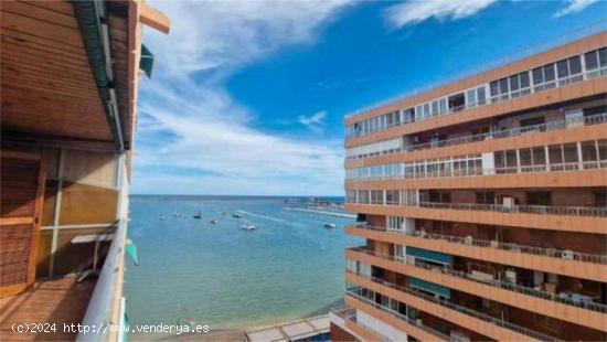  Piso en Venta en El Acequión, Torrevieja! Primera Línea con Acceso Directo a la Playa y Vistas Imp 