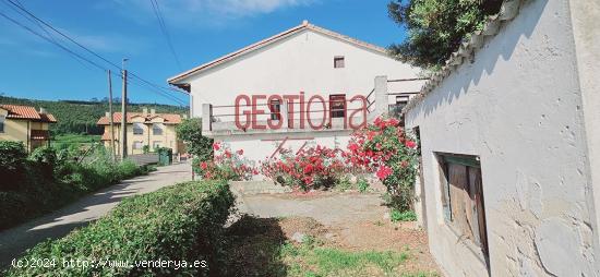 CASA ADOSADA CON TERRENO  EN ARNUERO. - CANTABRIA