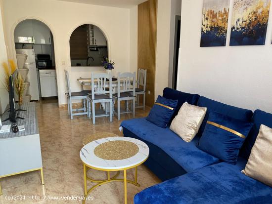 Bonito apartamento de planta baja con vista a la piscina y jardín comunal. - ALICANTE