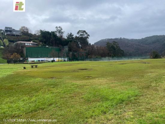 Parcela de terreno practicamente lisa. en la parte baja de Ixsuskiza a 5 minutos andando del club. -